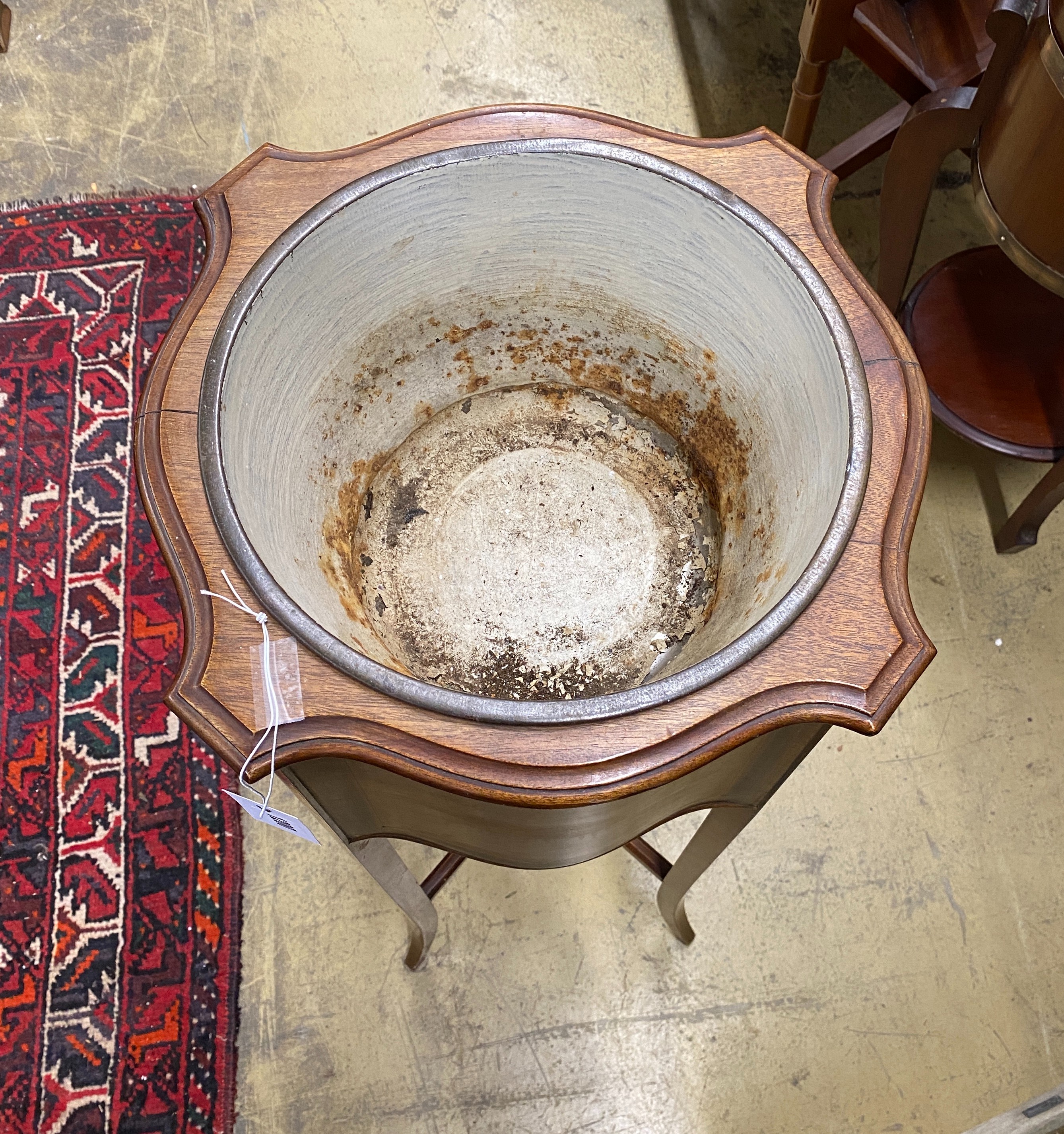 An Edwardian inlaid mahogany jardiniere of circular serpentine form, width 37cm, height 99cm